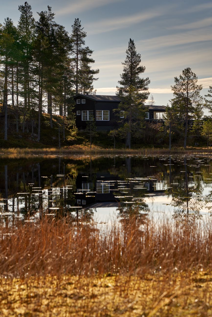 Norwegian fjord landscape with glass cabin